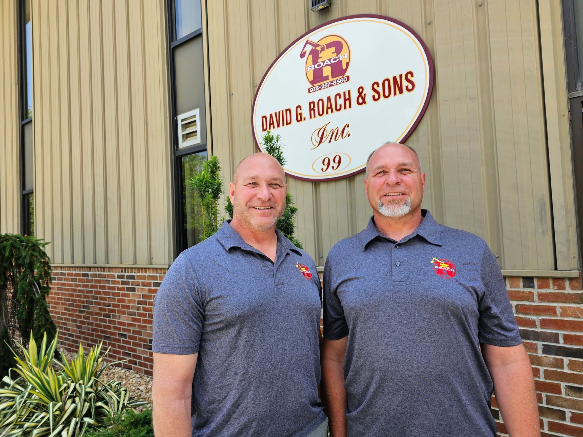 Daniel Roach and Darryl Roach in front of the David G. Roach & Sons headquarters